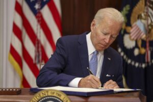 Biden signs 50 bills, including 1 backed by Paris Hilton, on Christmas Eve