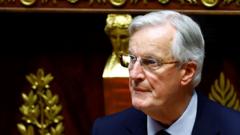 French PM Barnier pushes budget, government stability threatened