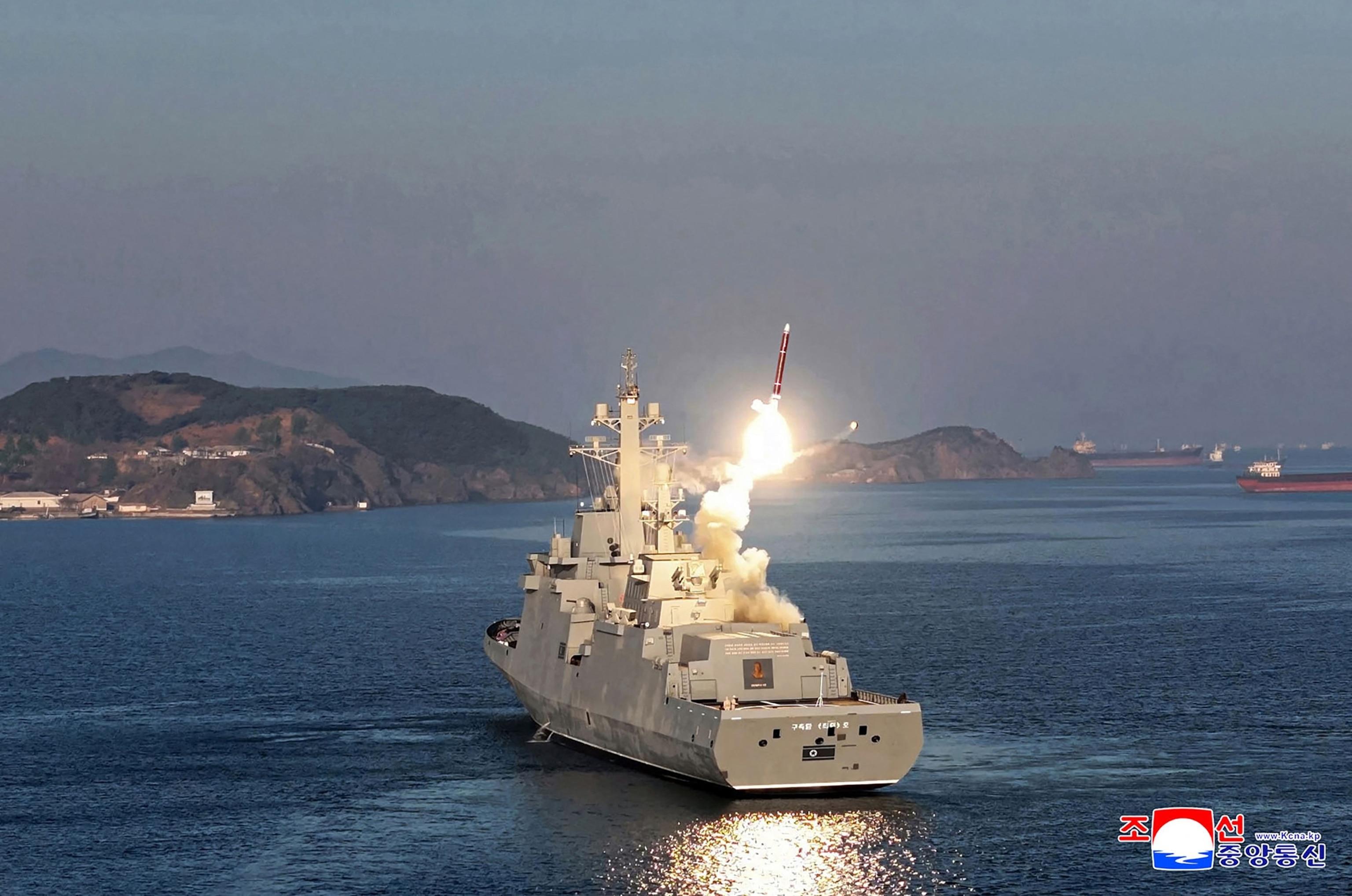 North Korea's Kim watches missile test-firings from country's first destroyer