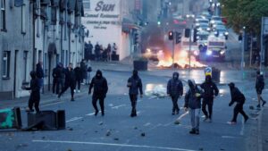 Northern Ireland burns for a third night, police unleash water cannon