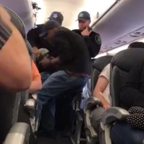 Plane Passenger Goes Viral for Video Showing Her Pulling Hair, Spitting on Fellow Flyer Over Seat Dispute